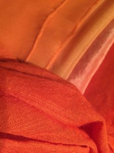 Silks and wool dyed with various strengths of Indian Madder (and correct mordant)